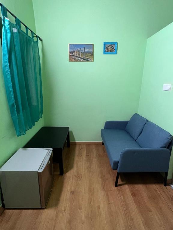 Posezení v ubytování Zouglas App Guesthouse