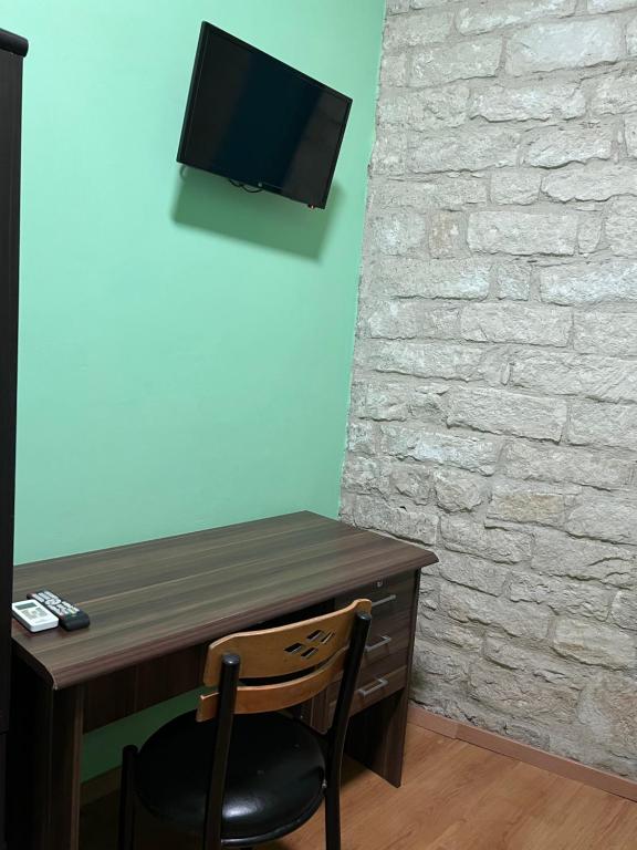 TV a/nebo společenská místnost v ubytování Zouglas App Guesthouse