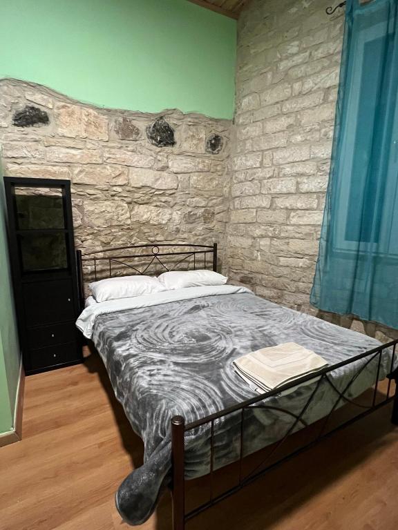 Postel nebo postele na pokoji v ubytování Zouglas App Guesthouse