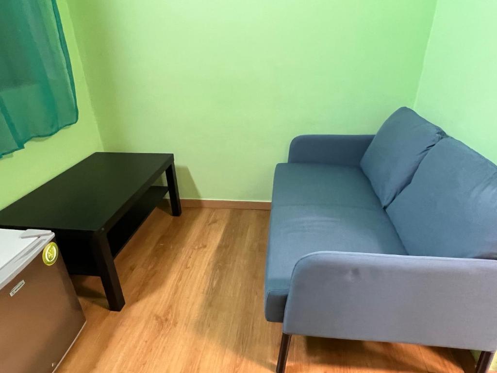 Posezení v ubytování Zouglas App Guesthouse