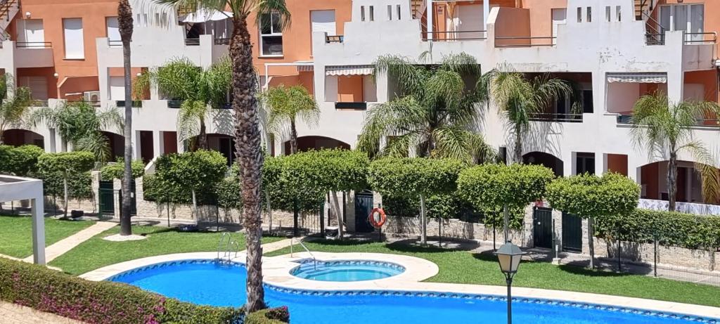 Bazén v ubytování Homes of Spain, Apartamentos Paraíso Vera Playa, Ed Nuku Hiva, Bajo X con PISCINA PRIVADA y jardín privado a PIE de PLAYA , WIFI nebo v jeho okolí