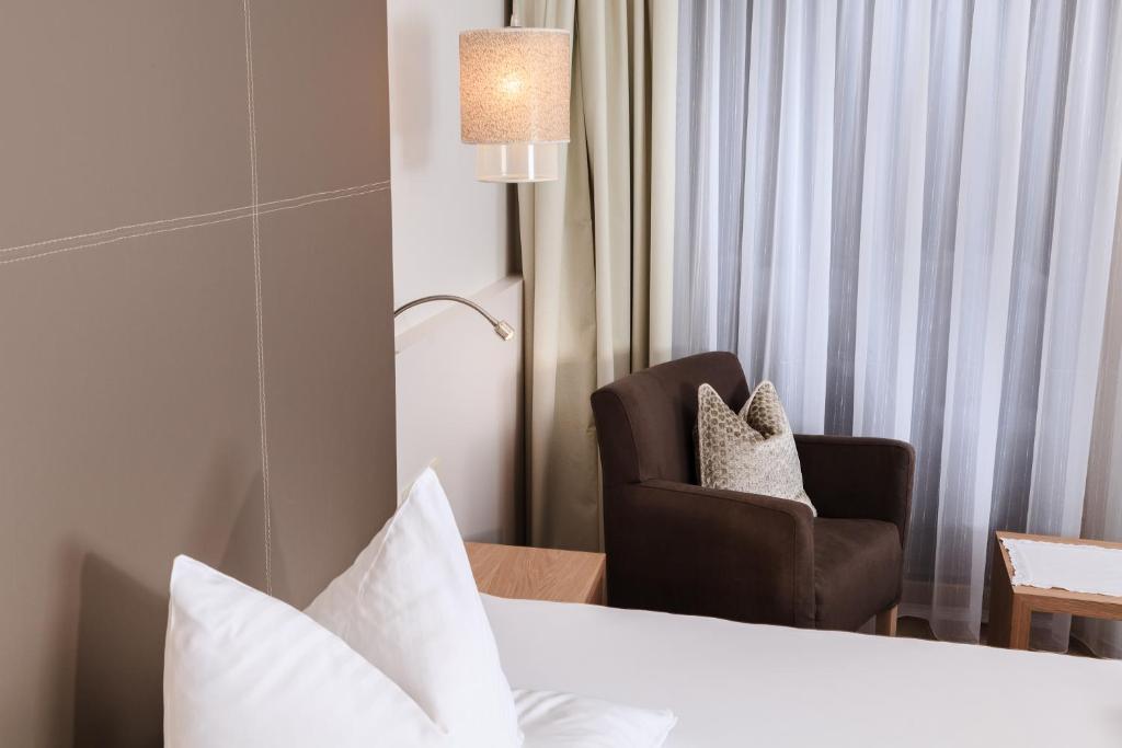 Postel nebo postele na pokoji v ubytování Hotel Trofana Alpin