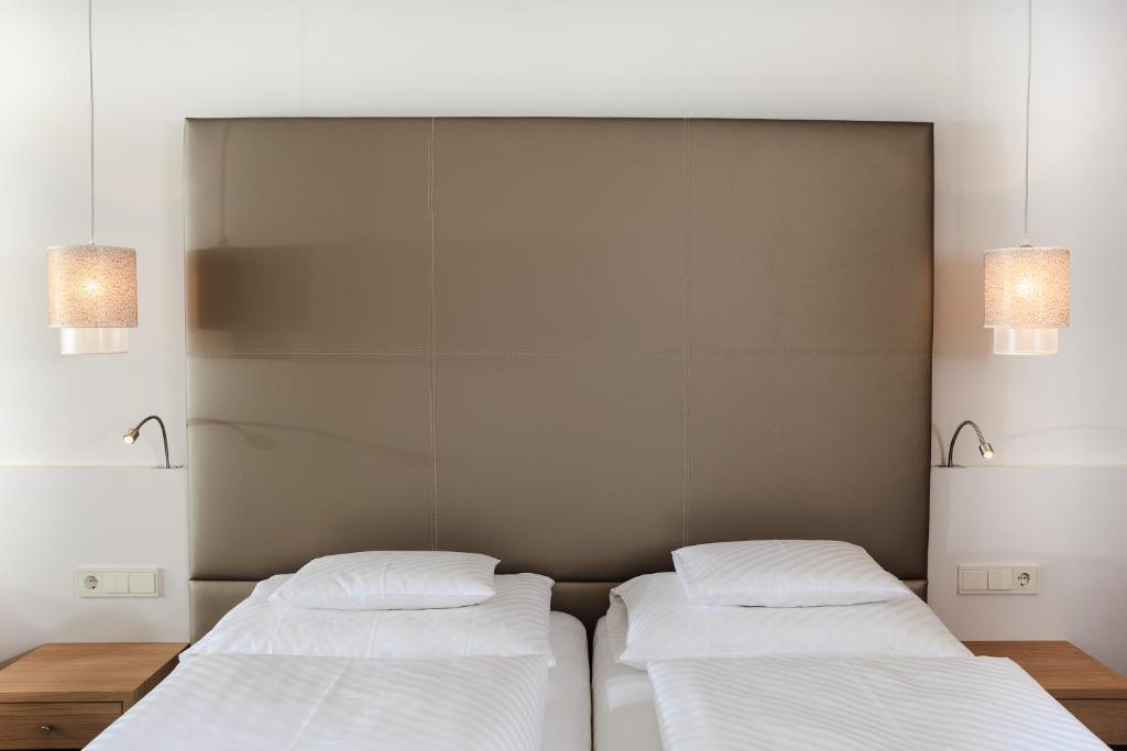 Postel nebo postele na pokoji v ubytování Hotel Trofana Alpin