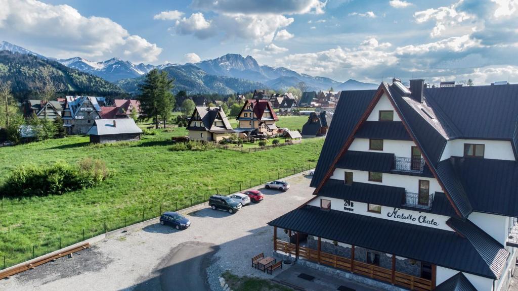 an aerial view of a village with mountains in the background at „Malućko Chata” in Zakopane