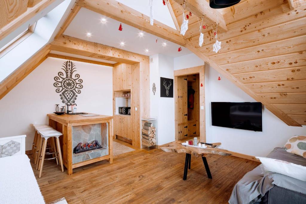 Apartament Tatry Folk regionalny Grota Solna tesisinde bir televizyon ve/veya eğlence merkezi