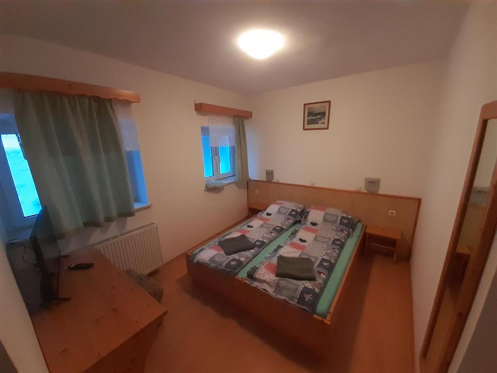 Postel nebo postele na pokoji v ubytování Rooms Barovc by the Lake Jasna