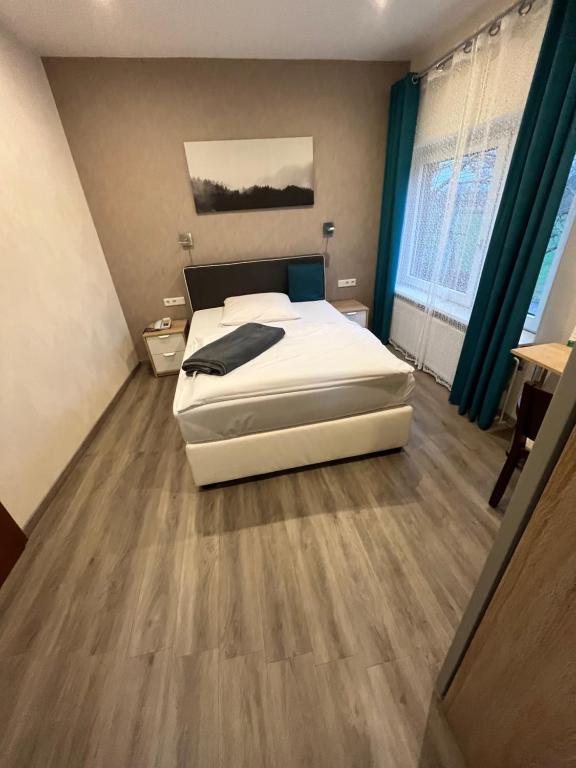Postel nebo postele na pokoji v ubytování Hotel Aquarius Braunschweig