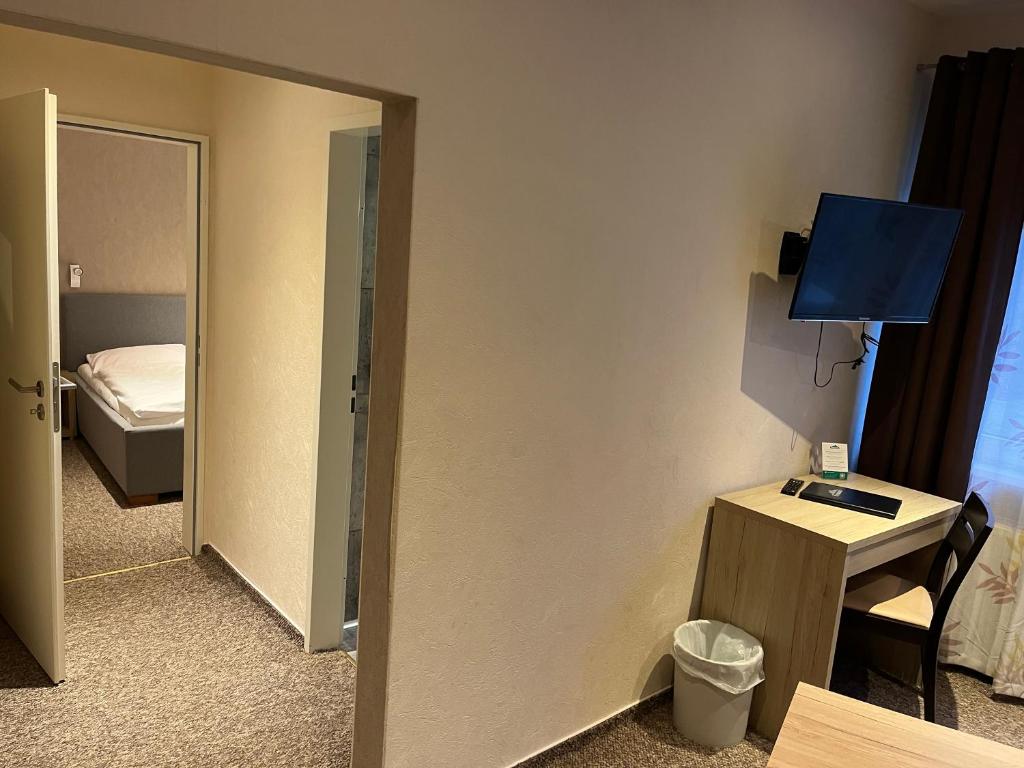 Postel nebo postele na pokoji v ubytování Hotel Aquarius Braunschweig