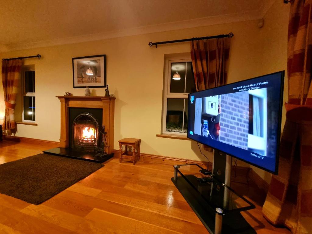 TV a/nebo společenská místnost v ubytování Millstone Cottages