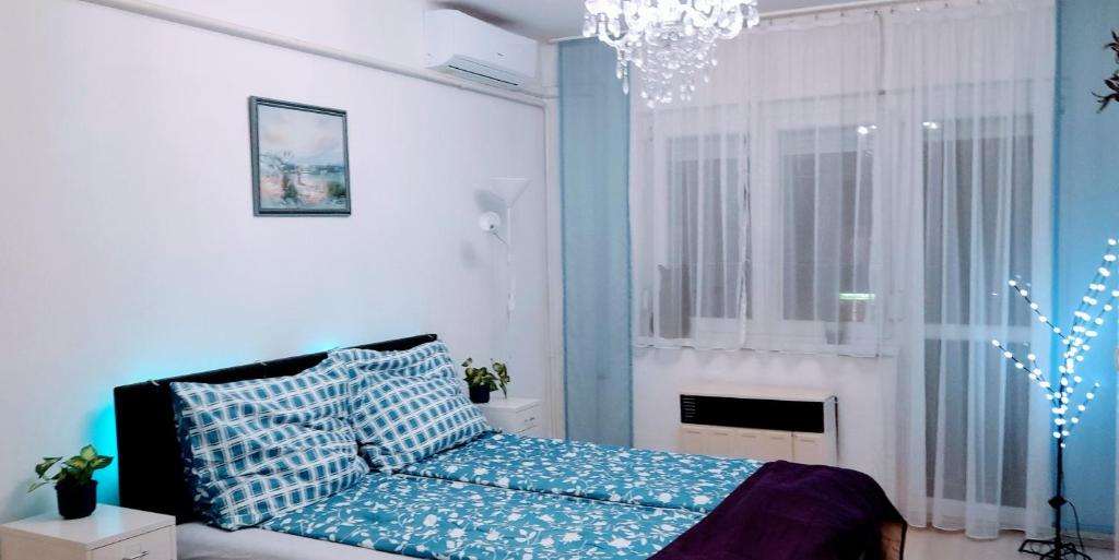 Postel nebo postele na pokoji v ubytování Pécs Central