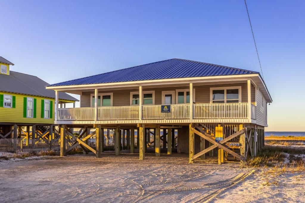 a house with a solar roof on the beach at Life's a Beach in Dauphin Island
