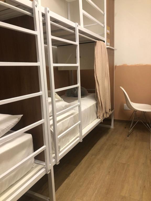 Postel nebo postele na pokoji v ubytování Angatu Hostel