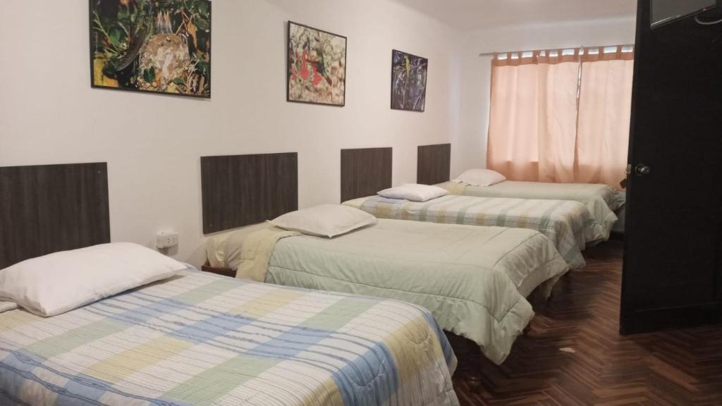 Ένα ή περισσότερα κρεβάτια σε δωμάτιο στο Qoricancha B&B Cusco