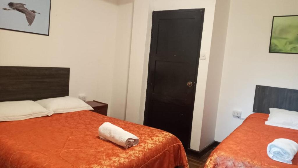 Ένα ή περισσότερα κρεβάτια σε δωμάτιο στο Qoricancha B&B Cusco
