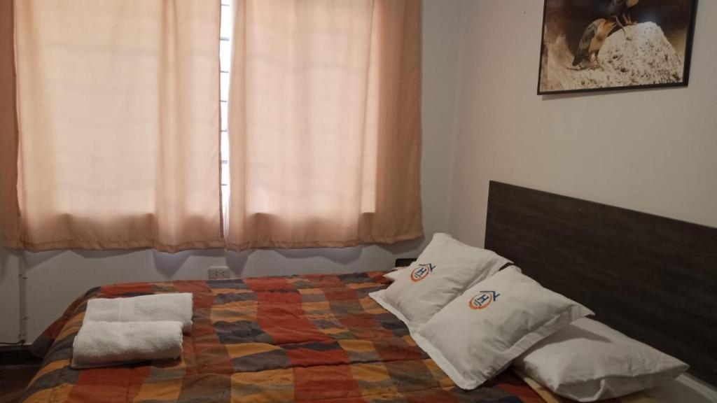 Ένα ή περισσότερα κρεβάτια σε δωμάτιο στο Qoricancha B&B Cusco