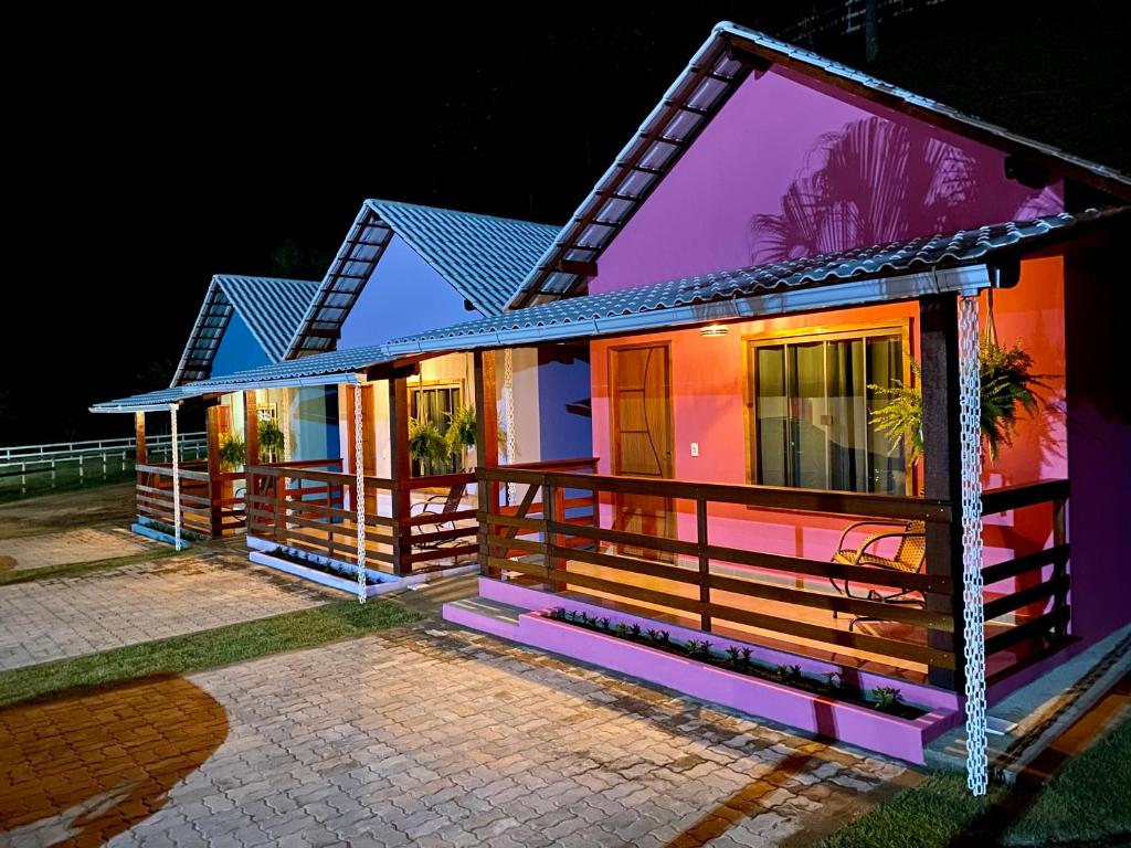 a house is lit up at night at Pousada Rancho na Serra in Espera Feliz