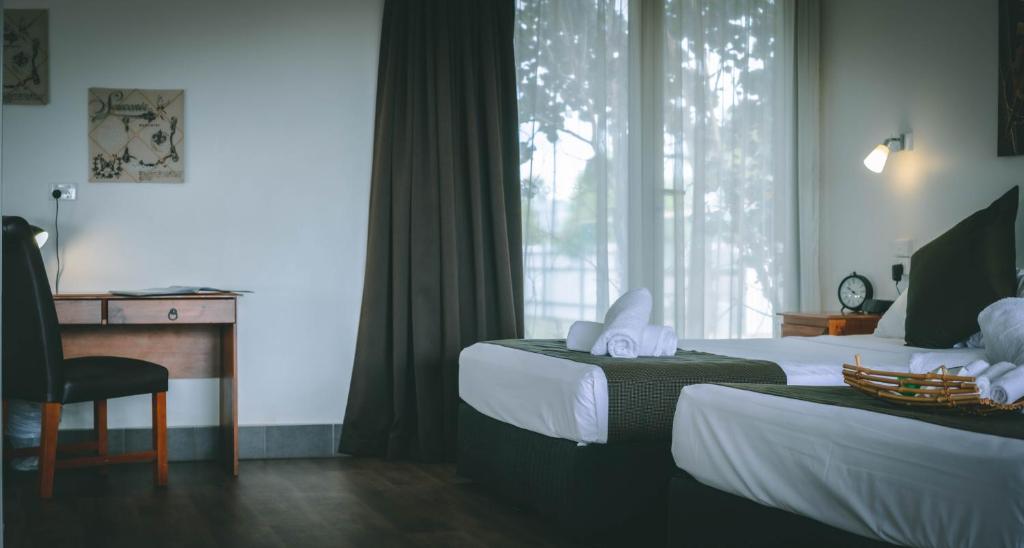 Postel nebo postele na pokoji v ubytování Darwin Resort