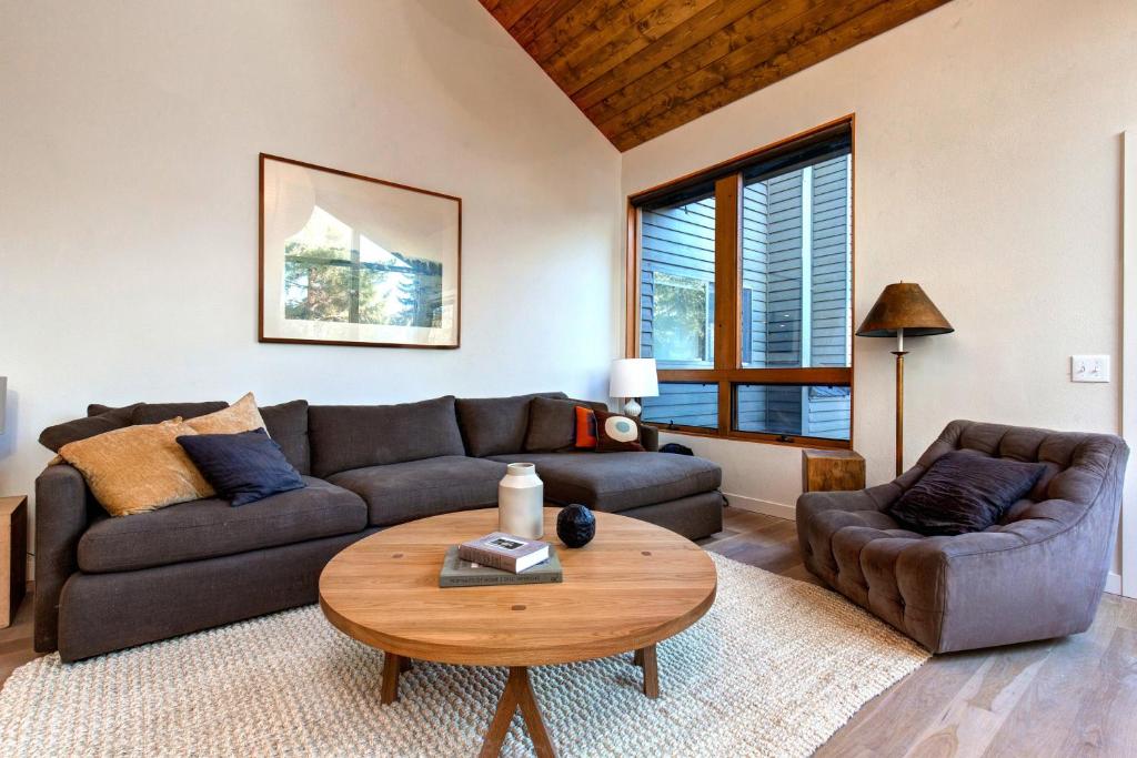 a living room with a couch and a table at Red Pine Wonder in Park City