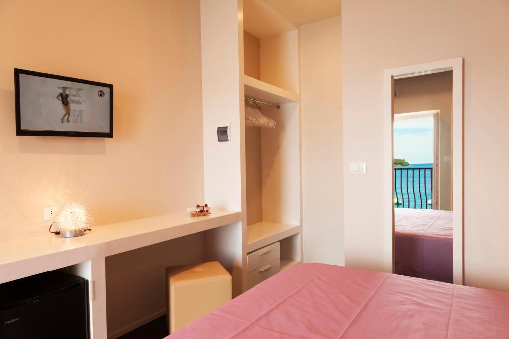Łóżko lub łóżka w pokoju w obiekcie Hotel l'Approdo