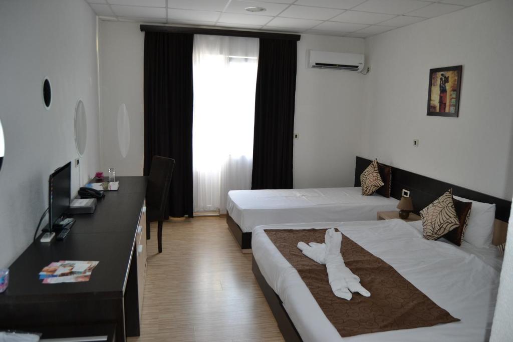 Ένα ή περισσότερα κρεβάτια σε δωμάτιο στο Sokoterme Hotel