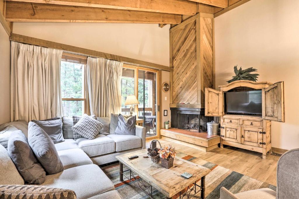 a living room with a couch and a tv at Truckee Home with 2 Balconies Less Than 1 Mi to Skiing! in Truckee