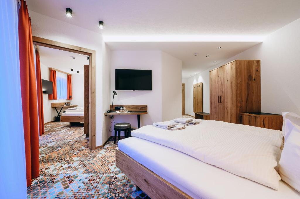 Postel nebo postele na pokoji v ubytování Hotel Grieserin