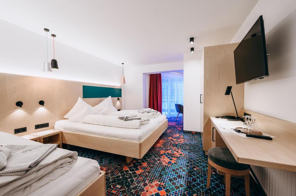 Postel nebo postele na pokoji v ubytování Hotel Grieserin