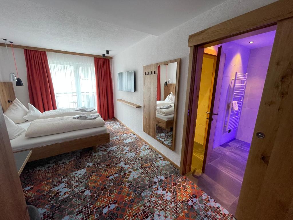 Postel nebo postele na pokoji v ubytování Hotel Grieserin