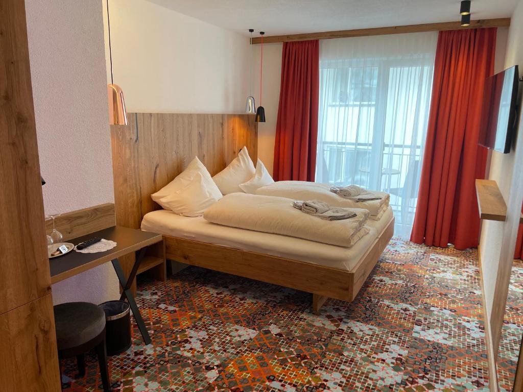 Postel nebo postele na pokoji v ubytování Hotel Grieserin