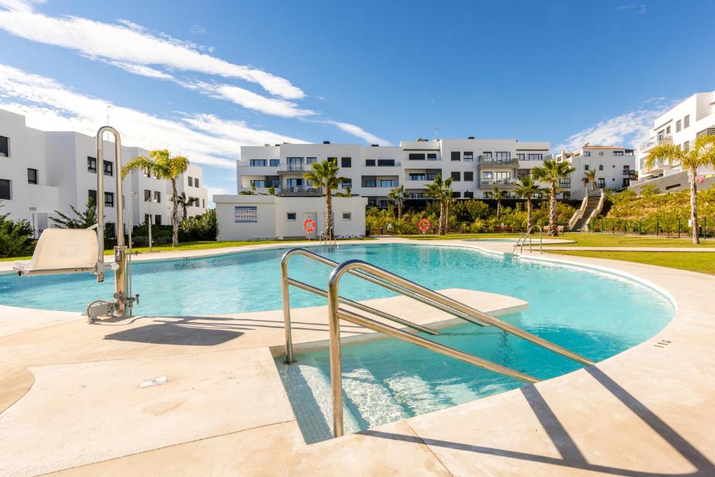 a swimming pool in a apartment with buildings in the background at Appartment Torre del Mar - 003 in Torre del Mar