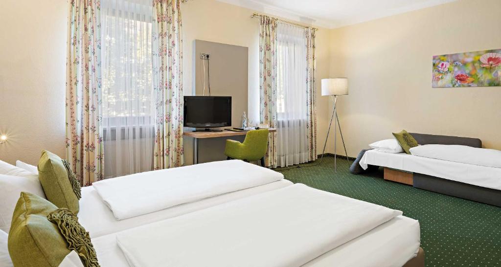 Postel nebo postele na pokoji v ubytování Hotel Liebl