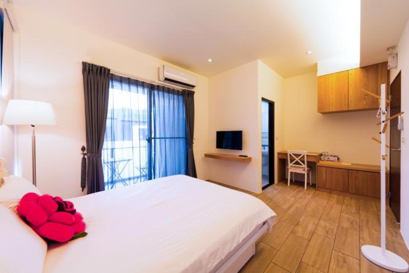 Postel nebo postele na pokoji v ubytování Ting Shuan B B&B