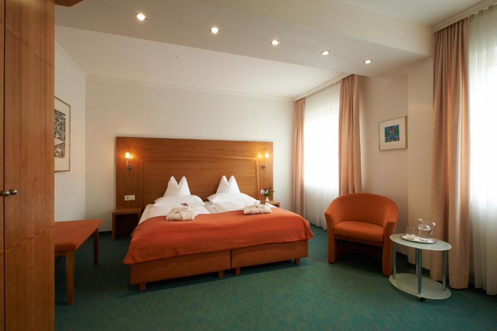 Postel nebo postele na pokoji v ubytování Hotel Klughardt