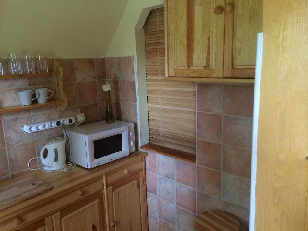 Kuchyň nebo kuchyňský kout v ubytování Őzike Apartmanházak
