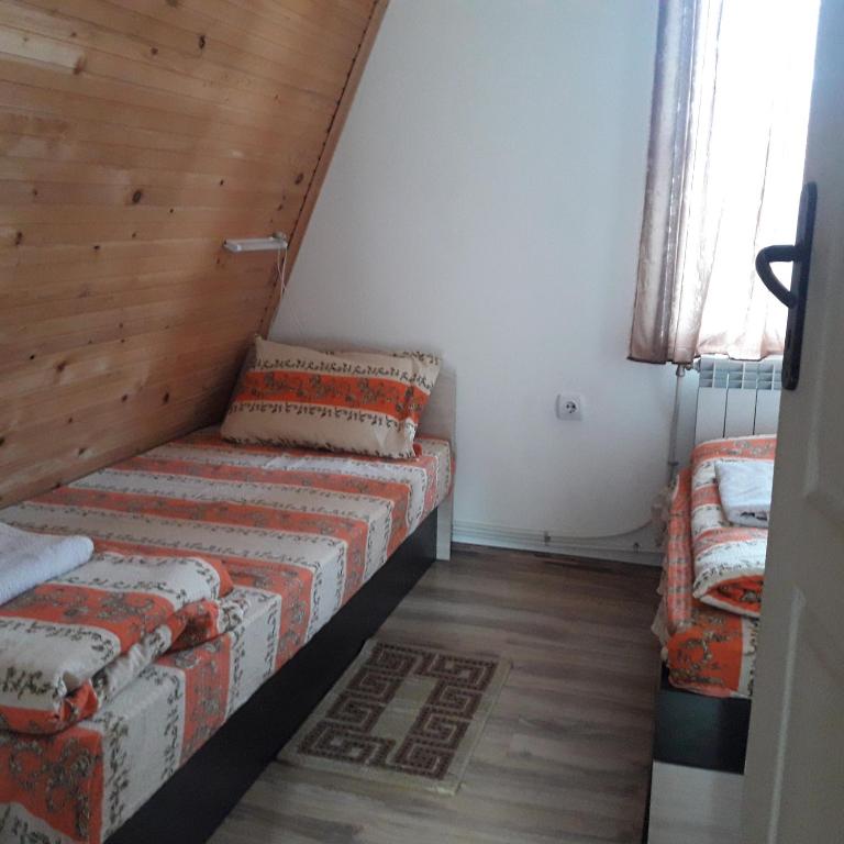 Postel nebo postele na pokoji v ubytování Vili Bilyana