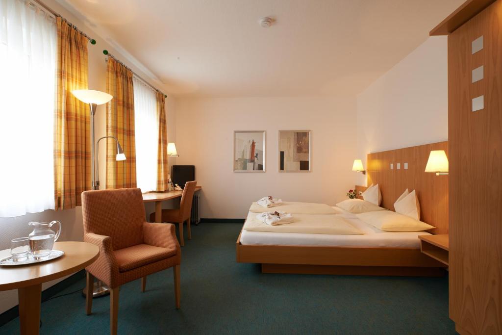 Säng eller sängar i ett rum på Hotel Klughardt