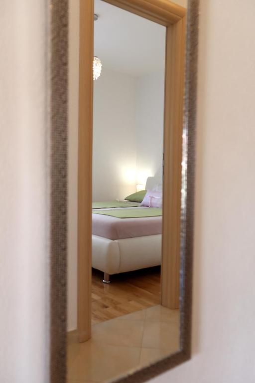 Posteľ alebo postele v izbe v ubytovaní Apartmani Kolak