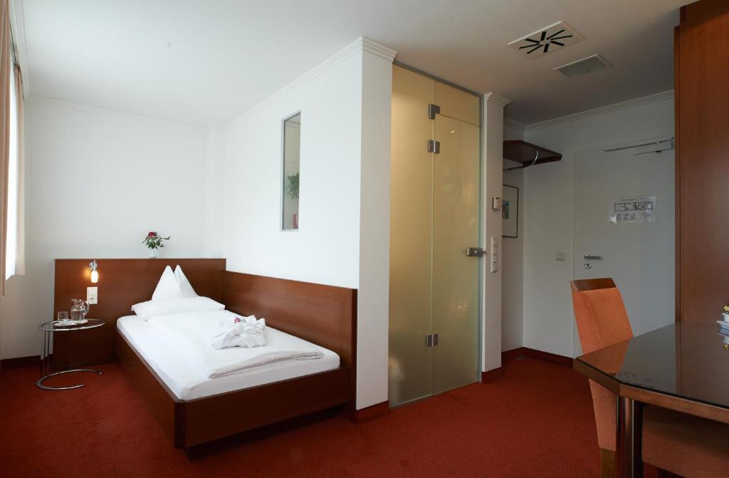 Postel nebo postele na pokoji v ubytování Hotel Klughardt
