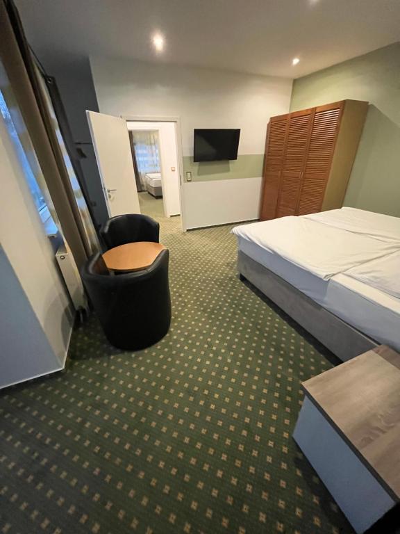 Postel nebo postele na pokoji v ubytování Hotel Aquarius Braunschweig