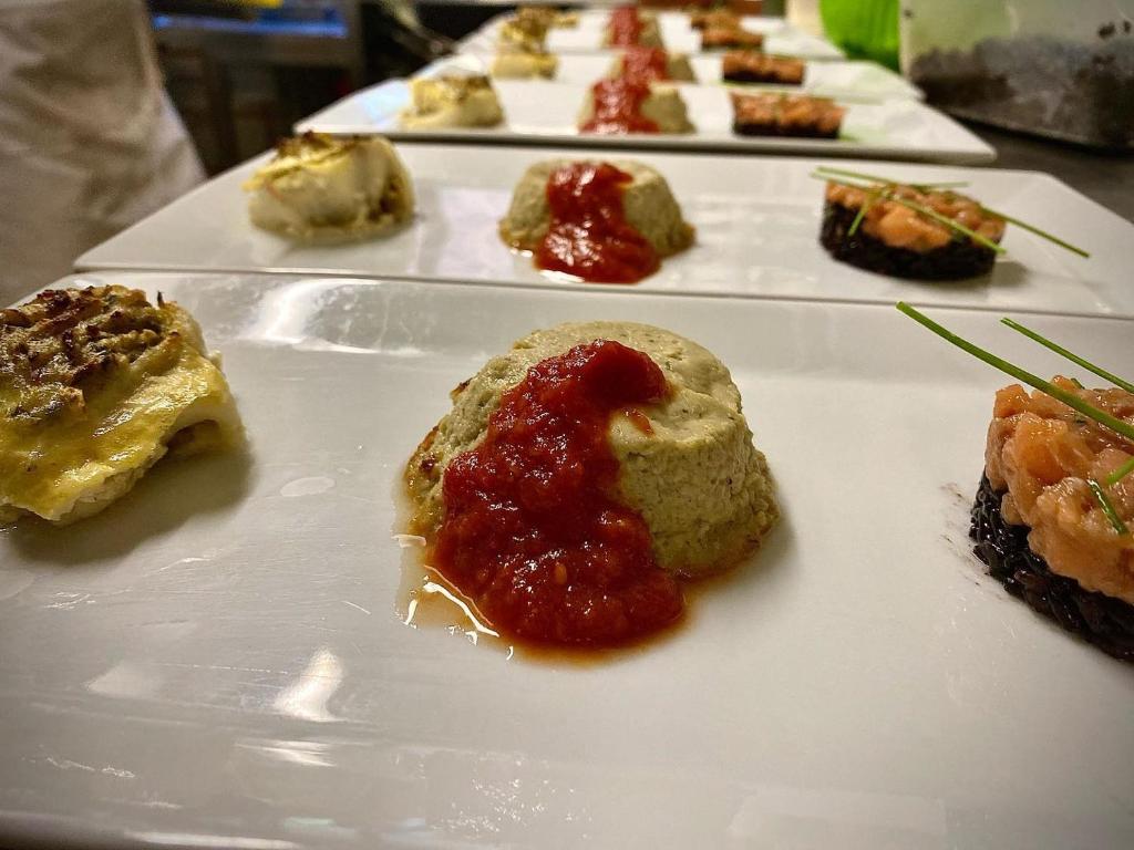 a white plate topped with different types of desserts at Hotel Edelweiss in Limone Piemonte