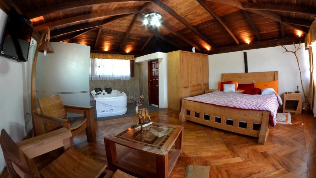 Postel nebo postele na pokoji v ubytování Hosteria San Jose de Sigchos