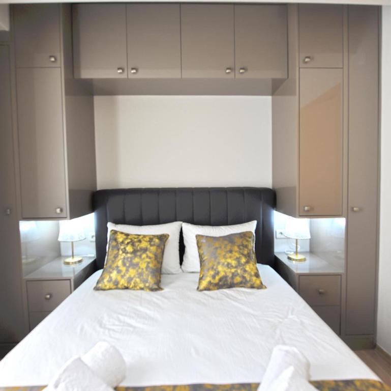 Postel nebo postele na pokoji v ubytování Ozgur City Residence
