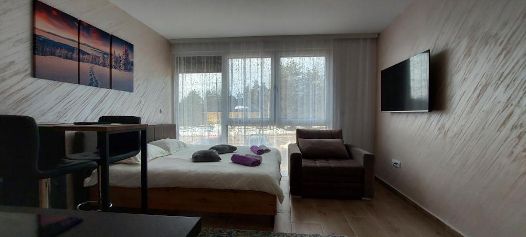 Postel nebo postele na pokoji v ubytování Sumski san 2