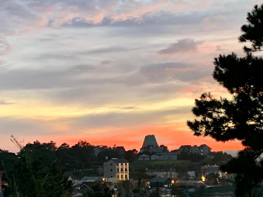 a view of a city at sunset at Villa Délight House “Stay&Chill” in Da Lat