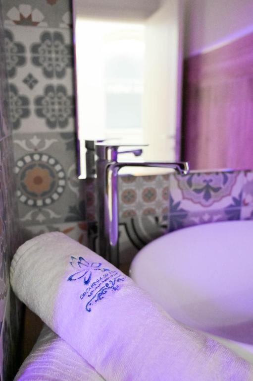 Postel nebo postele na pokoji v ubytování B&B Orchidea Celeste