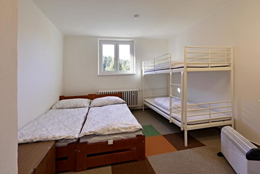 Postel nebo postele na pokoji v ubytování Chata Myslivna