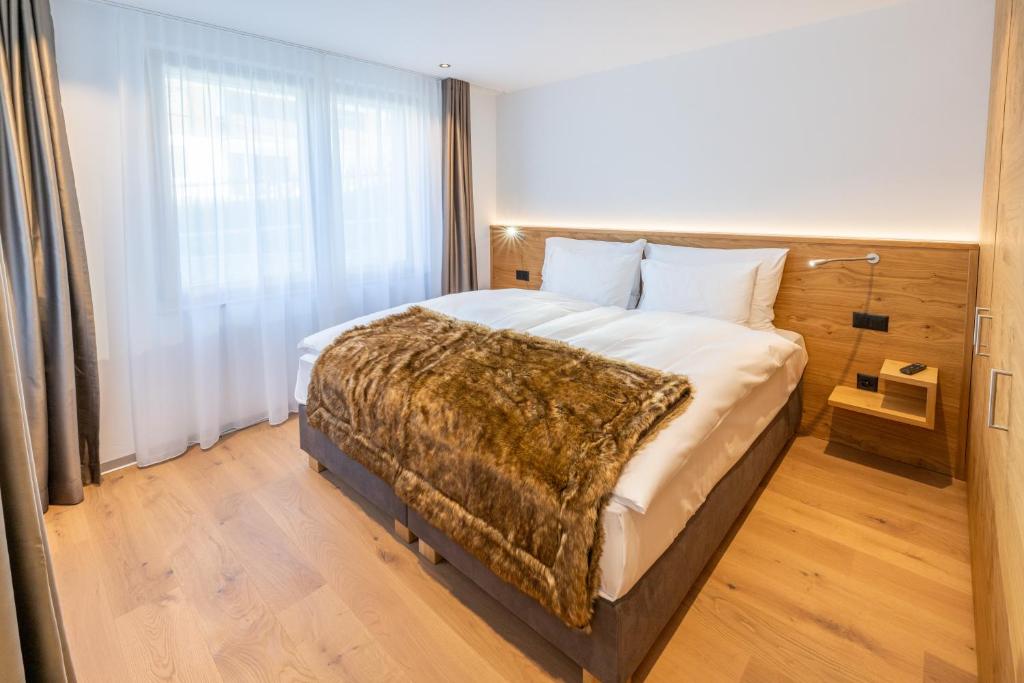 Postel nebo postele na pokoji v ubytování Luxury Residence Colosseo Zermatt