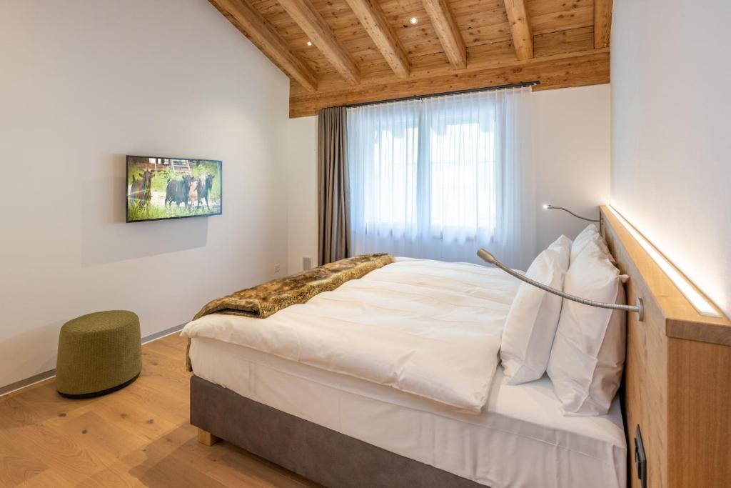 Postel nebo postele na pokoji v ubytování Luxury Residence Colosseo Zermatt