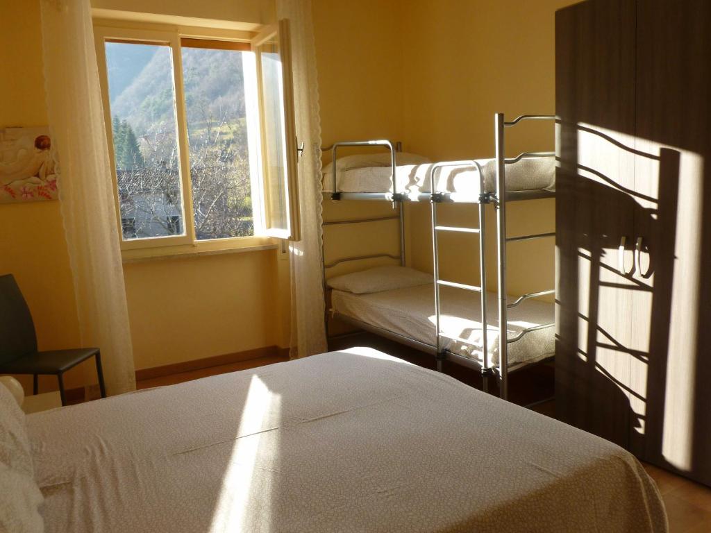 Postel nebo postele na pokoji v ubytování Casa Teodoro - Gelsomino, Ulivi & Orchidea