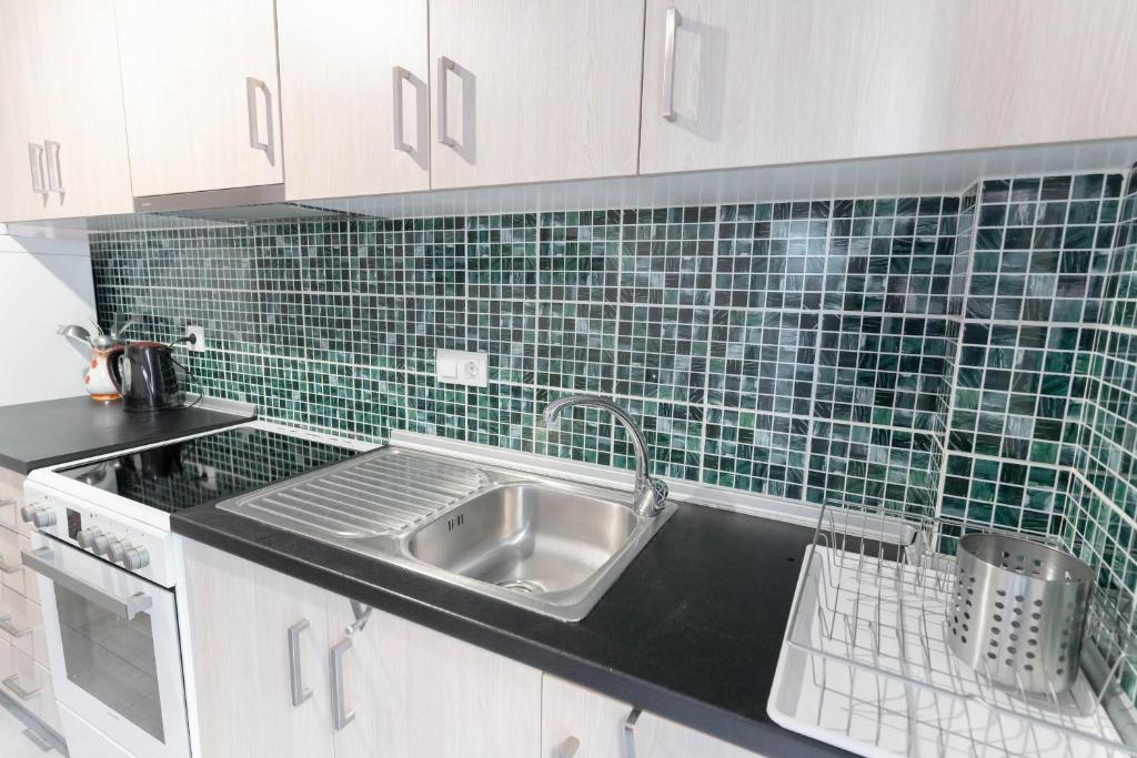 A kitchen or kitchenette at BYT Downtown Flat